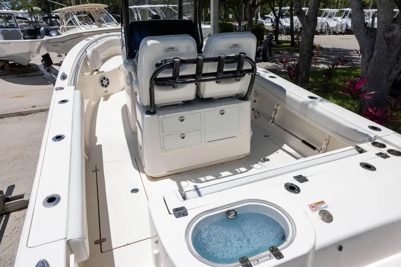 Slide: The Image of 2020 Cobia 262 Center Console boat interior with seating and storage compartments. - 4