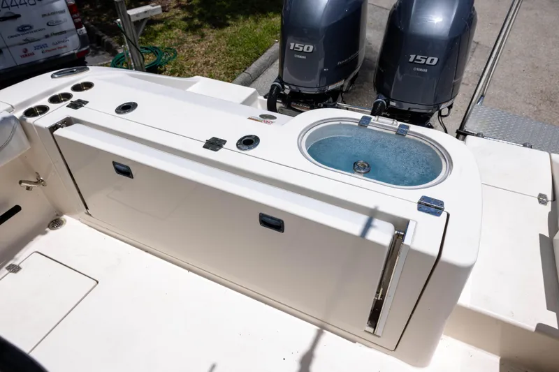 Slide: The Image of 2020 Cobia 262 Center Console boat with dual Yamaha 150 engines and livewell. - 5