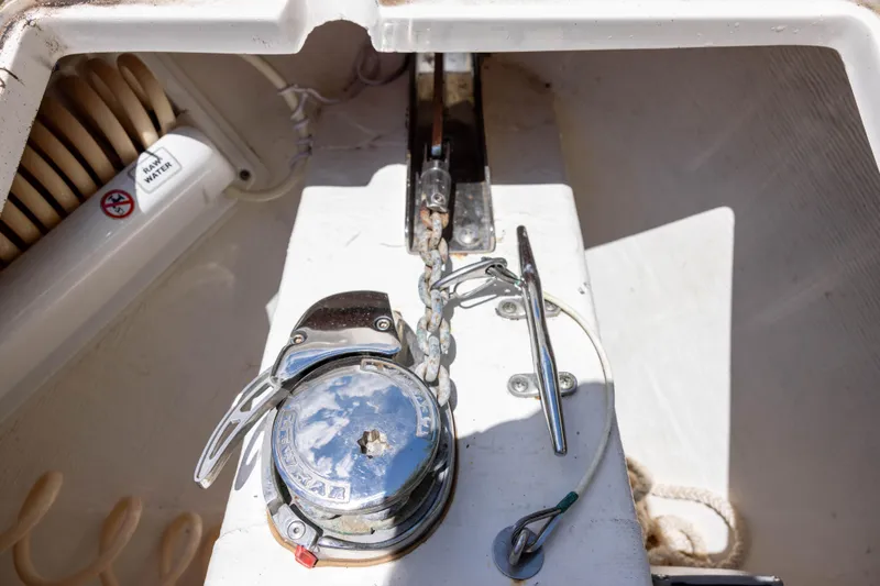 Slide: The Image of Anchor chain mechanism on a 2020 Cobia 262 Center Console boat deck. - 9