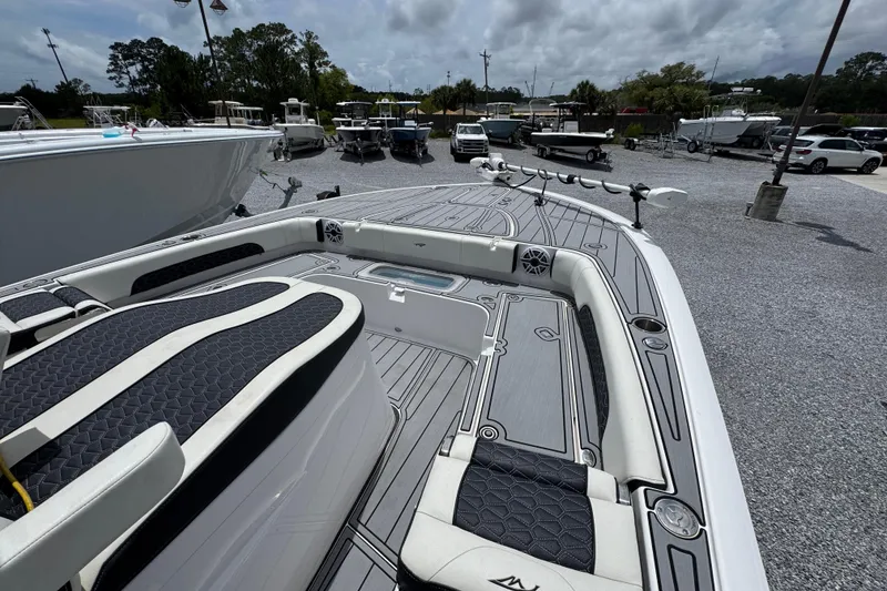 Slide: The Image of 2024 Tidewater 3100 Carolina Bay boat interior with sleek seating and modern design. - 12