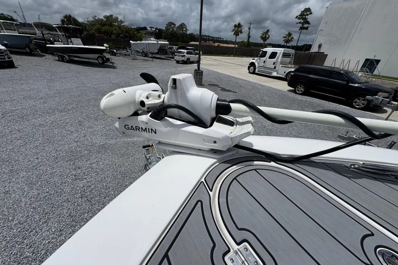 Slide: The Image of 2024 Tidewater 3100 Carolina Bay boat with Garmin equipment in a marina setting. - 15