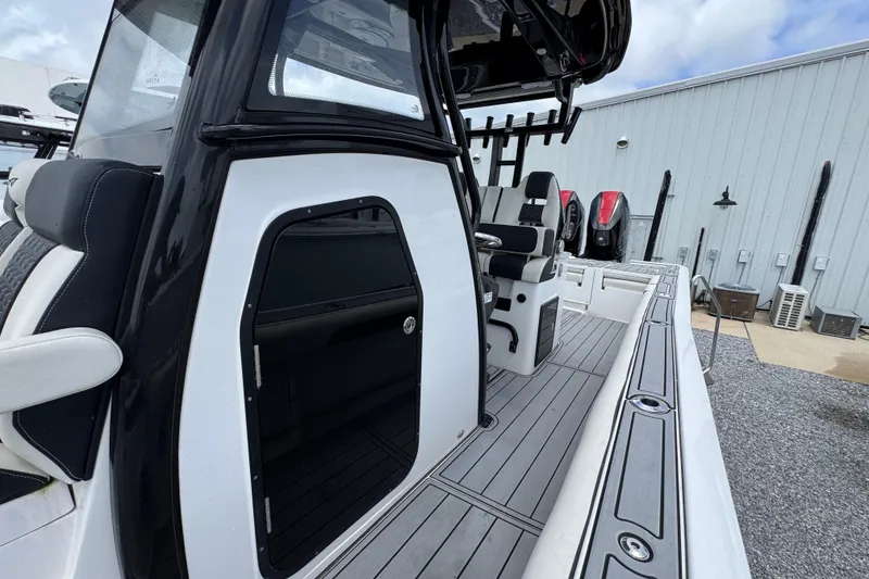 Slide: The Image of 2024 Tidewater 3100 Carolina Bay boat interior with sleek seating and modern design. - 19