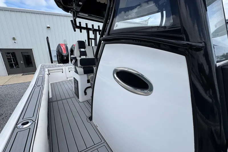 Slide: The Image of 2024 Tidewater 3100 Carolina Bay boat interior with sleek seating and modern design. - 20