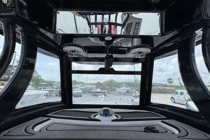 Slide: The Image of Interior view of 2024 Tidewater 3100 Carolina Bay boat cockpit with panoramic windows. - 28