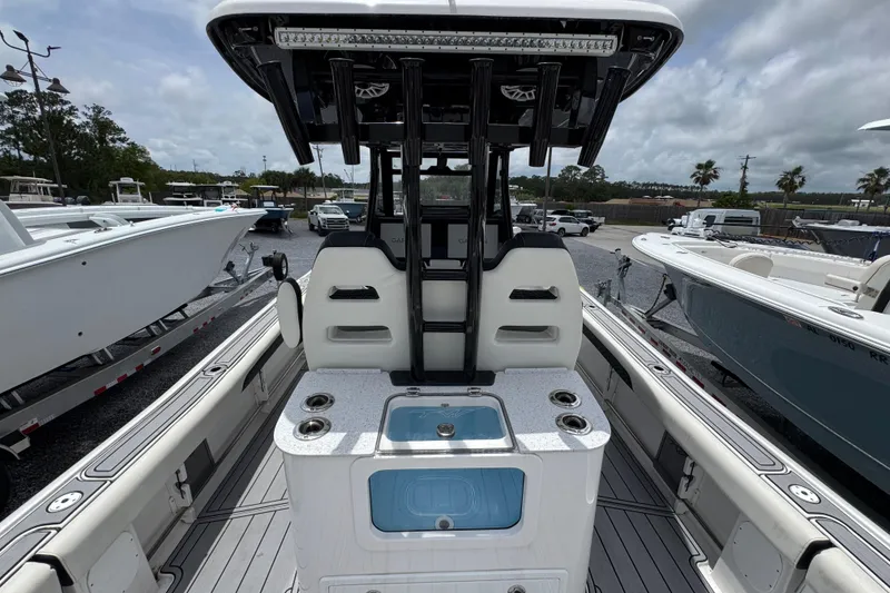 Slide: The Image of 2024 Tidewater 3100 Carolina Bay boat interior with seating and fishing amenities. - 30