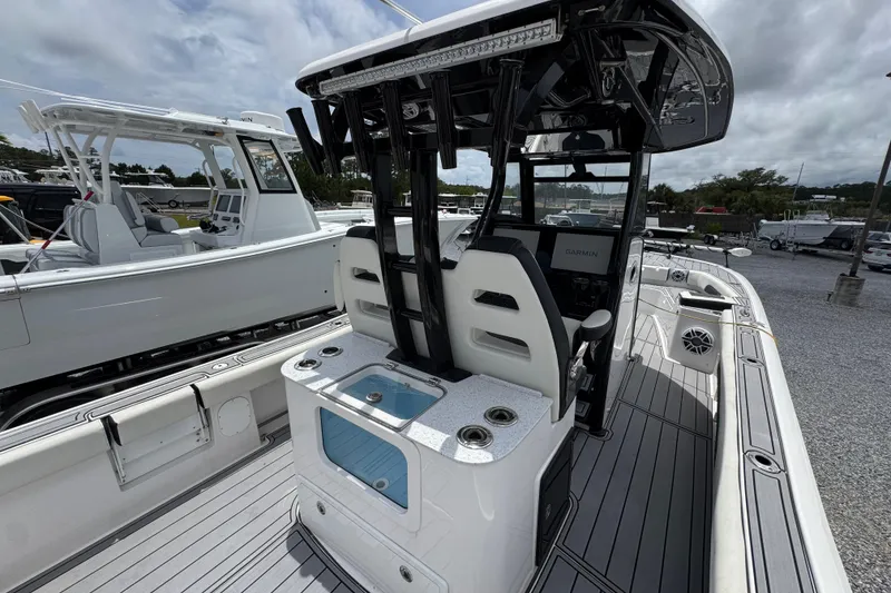 Slide: The Image of 2024 Tidewater 3100 Carolina Bay boat interior with modern console and seating. - 31
