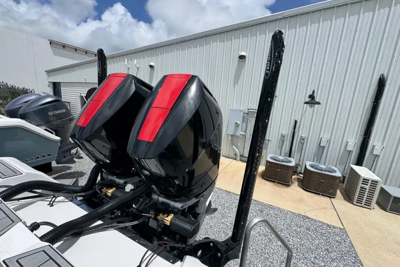 Slide: The Image of 2024 Tidewater 3100 Carolina Bay boat with dual outboard engines and Power-Pole anchors. - 34