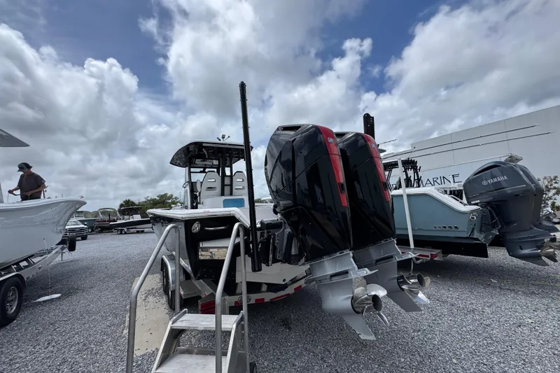 Slide: The Image of 2024 Tidewater 3100 Carolina Bay boat with dual outboard engines on display. - 8