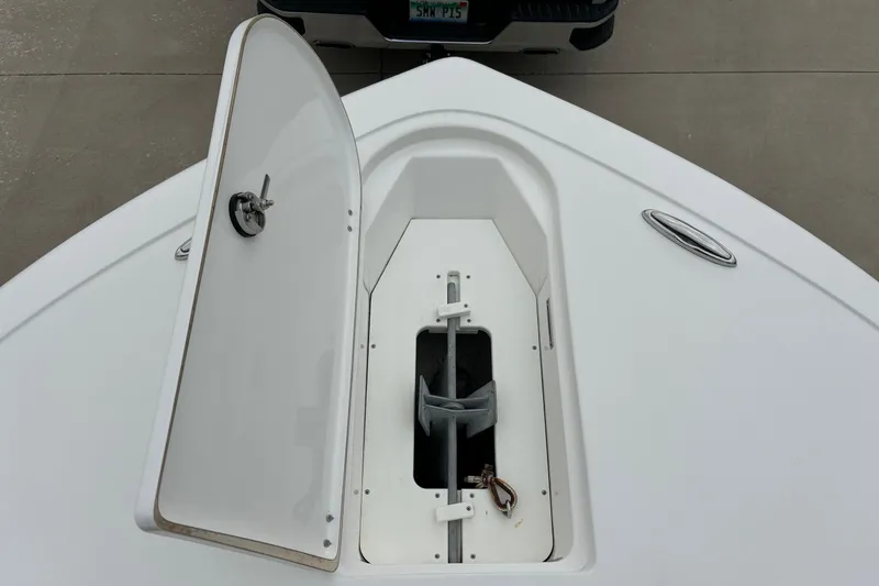 Slide: The Image of Open anchor compartment on 2016 Tidewater 252 CC Adventure boat. - 18