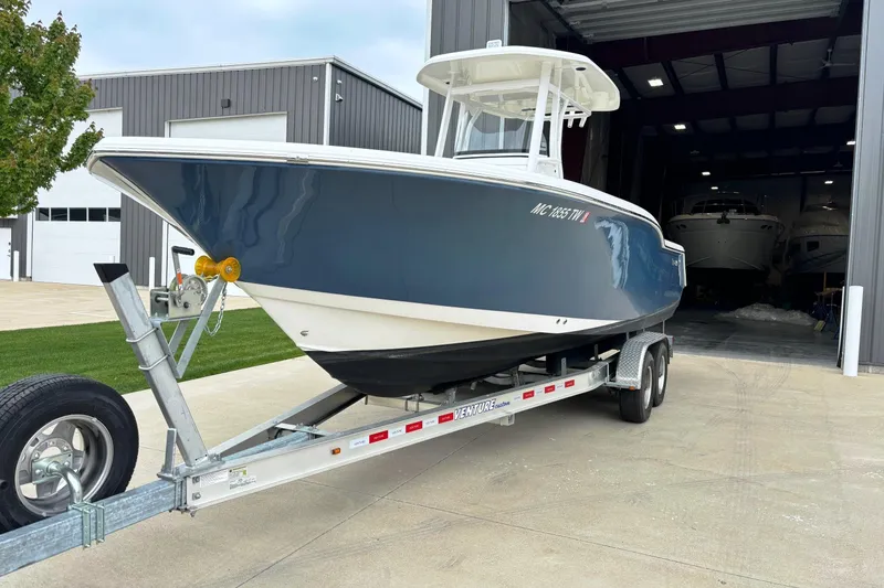 Slide: The Image of 2016 Tidewater 252 CC Adventure boat on trailer outside storage facility. - 5