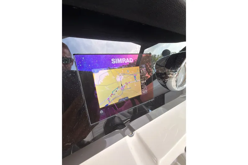 Slide: The Image of Simrad navigation display on 2021 Sea Ray SPX 190 boat dashboard. - 17