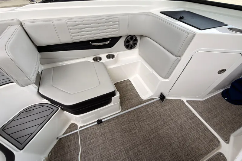 Slide: The Image of Interior of 2021 Sea Ray SPX 190 boat with cushioned seating and modern design. - 21