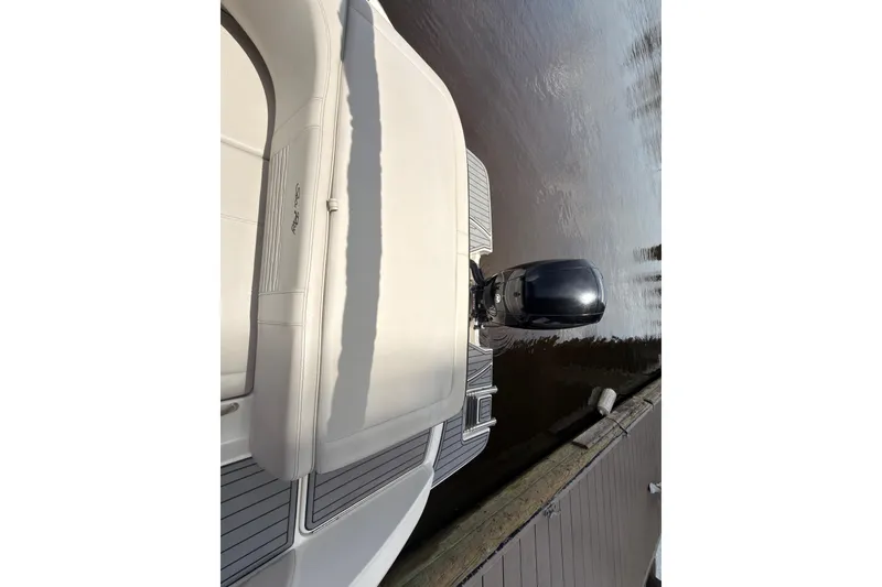 Slide: The Image of 2021 Sea Ray SPX 190 boat with outboard motor docked on calm water. - 25