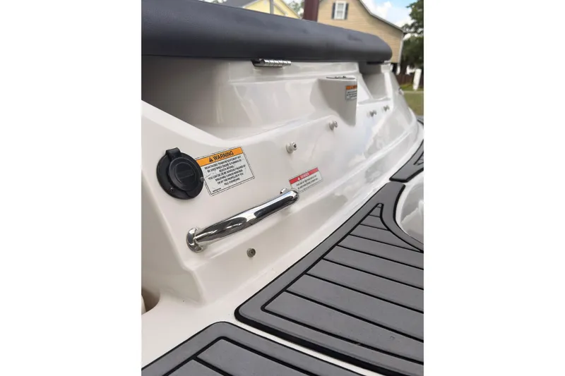 Slide: The Image of 2021 Sea Ray SPX 190 boat deck with warning labels and sleek design. - 26