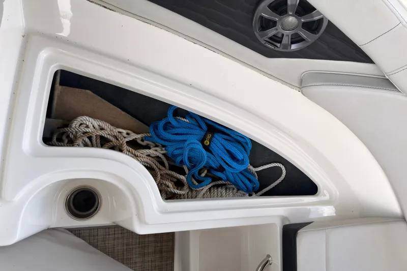 Slide: The Image of Storage compartment with ropes on a 2021 Sea Ray SPX 190 boat. - 31