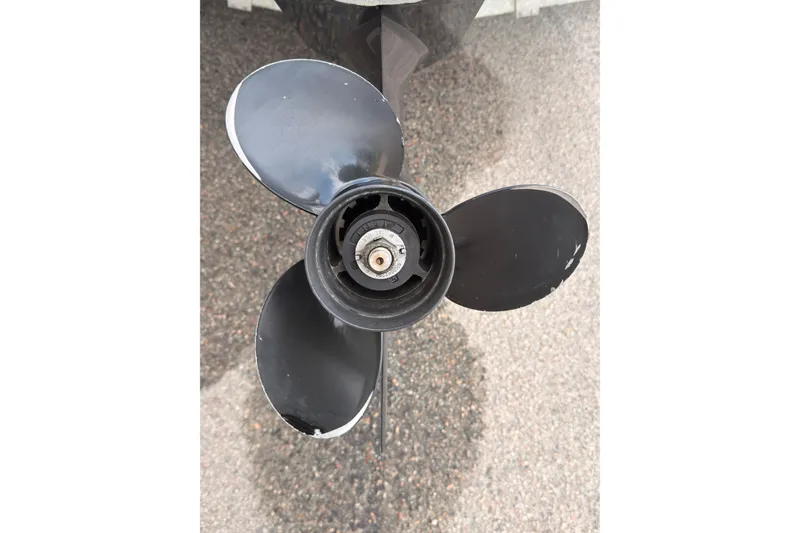 Slide: The Image of Close-up of a 2021 Sea Ray SPX 190 boat propeller on pavement. - 36
