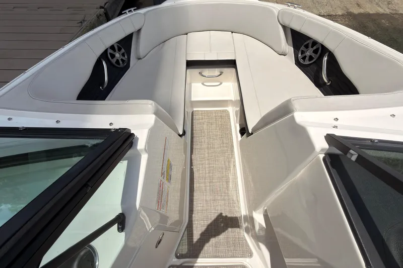 Slide: The Image of 2021 Sea Ray SPX 190 boat interior with white seating and modern design. - 5
