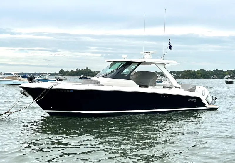 Slide: The Image of 2020 Tiara Sport 34 LS boat on calm water, side view. - 5