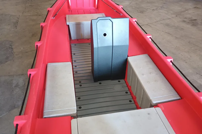 Slide: The Image of 2024 Whaly 455R boat interior with red hull and gray seating. - 11