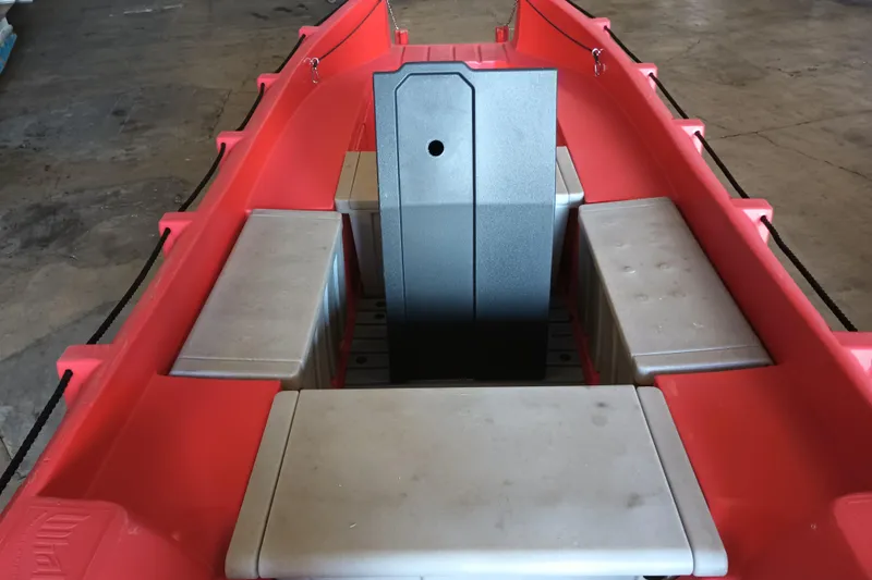 Slide: The Image of Red 2024 Whaly 455R boat interior with seating and central console. - 13