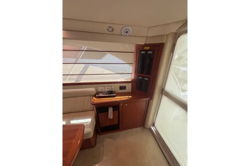 Slide: The Image of Interior of 2006 Riviera 37 Flybridge yacht with control panel and seating area. - 11
