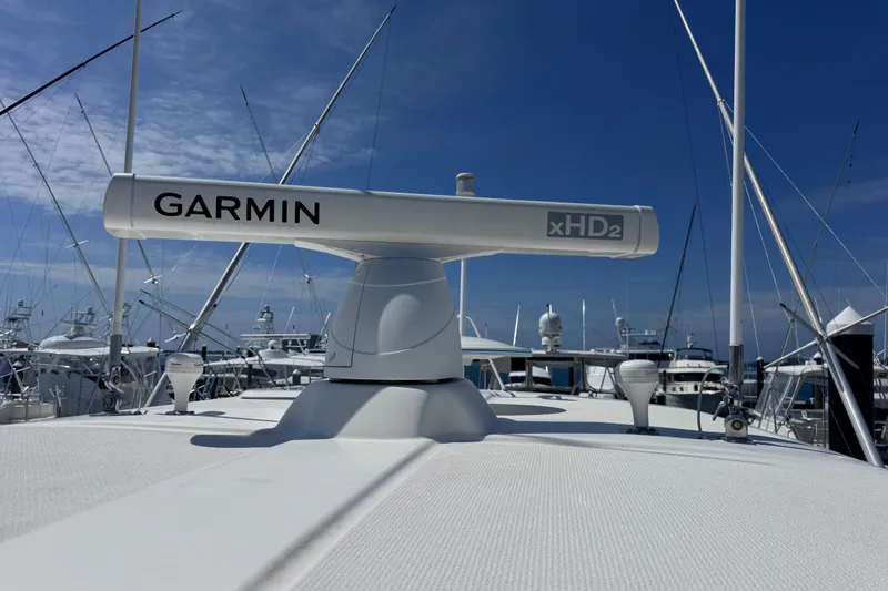 Slide: The Image of Garmin xHD2 radar on 2006 Riviera 37 Flybridge yacht under clear blue sky. - 33