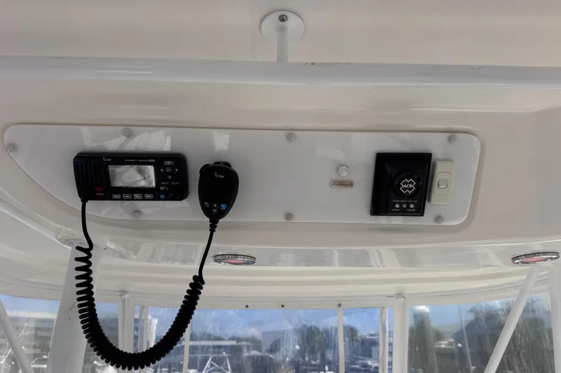 Slide: The Image of 2006 Riviera 37 Flybridge control panel with radio and navigation equipment. - 34