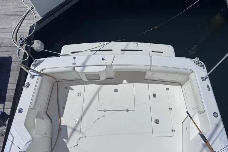 Slide: The Image of 2006 Riviera 37 Flybridge boat deck, featuring spacious seating and storage compartments. - 36