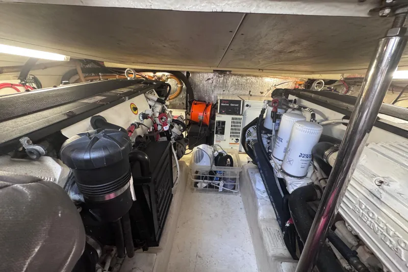 Slide: The Image of Engine room of a 2006 Riviera 37 Flybridge yacht, featuring Volvo Penta components. - 39