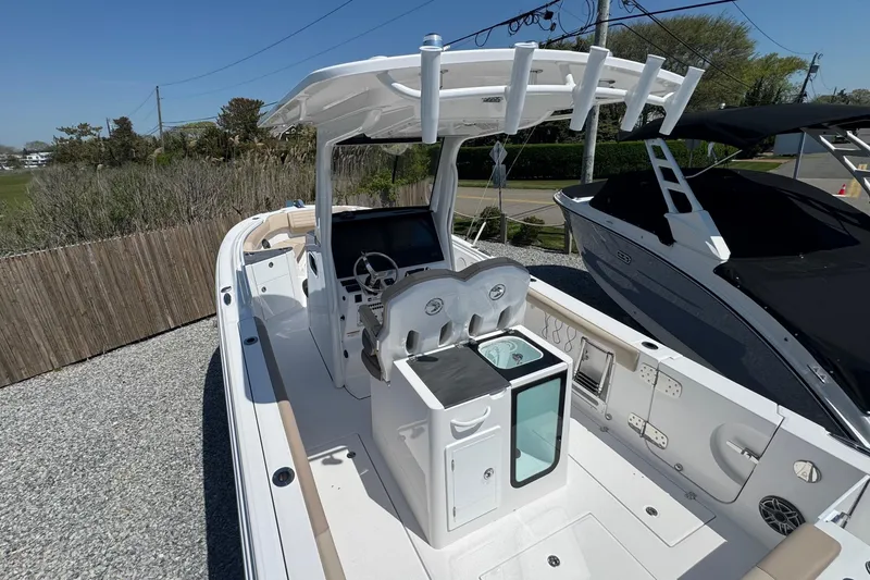 Slide: The Image of 2026 Edgewater 262CC boat with sleek design, spacious deck, and modern amenities. - 16