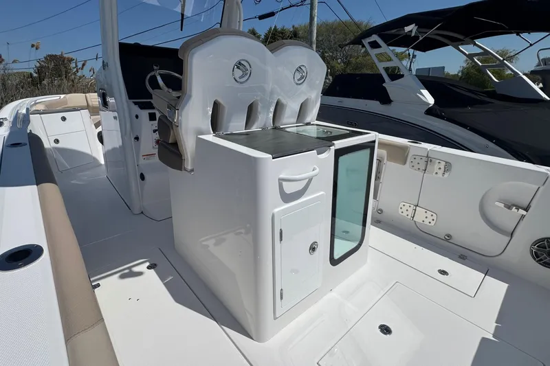 Slide: The Image of 2026 Edgewater 262CC boat interior with seating and storage compartments. - 17