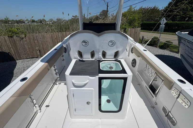 Slide: The Image of 2026 Edgewater 262CC boat interior with storage and seating, showcasing modern design and functionality. - 20