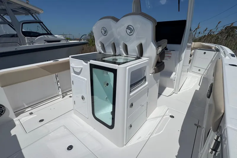 Slide: The Image of 2026 Edgewater 262CC boat interior with seating and storage compartments. - 22