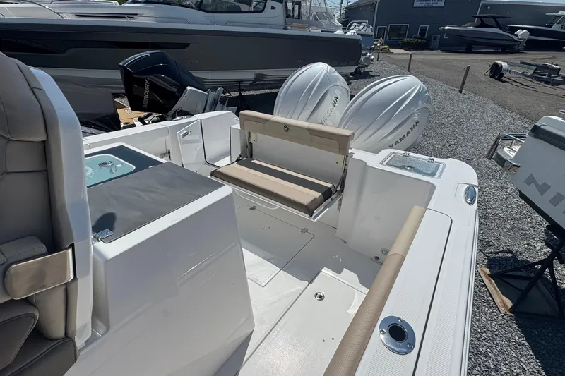 Slide: The Image of 2026 Edgewater 262CC boat interior with seating and dual Yamaha engines. - 25