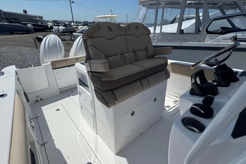 Slide: The Image of 2026 Edgewater 262CC boat interior with dual seats and steering console. - 32