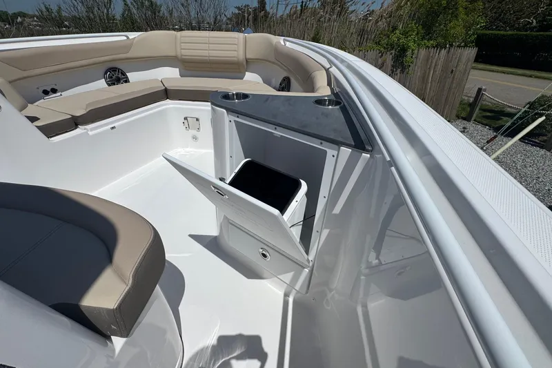 Slide: The Image of Interior of 2026 Edgewater 262CC boat with seating and storage compartment. - 45