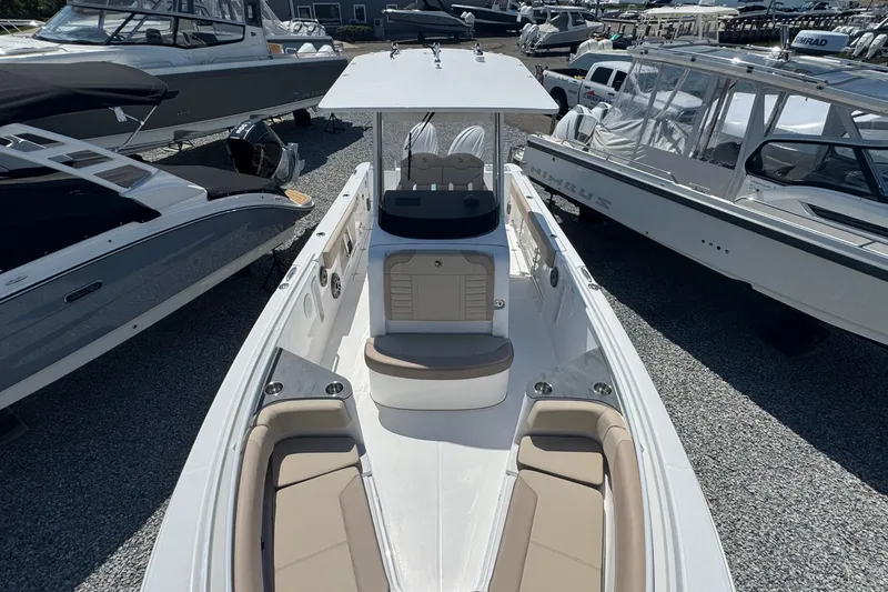 Slide: The Image of 2026 Edgewater 262CC boat with sleek design and spacious seating, displayed outdoors. - 48
