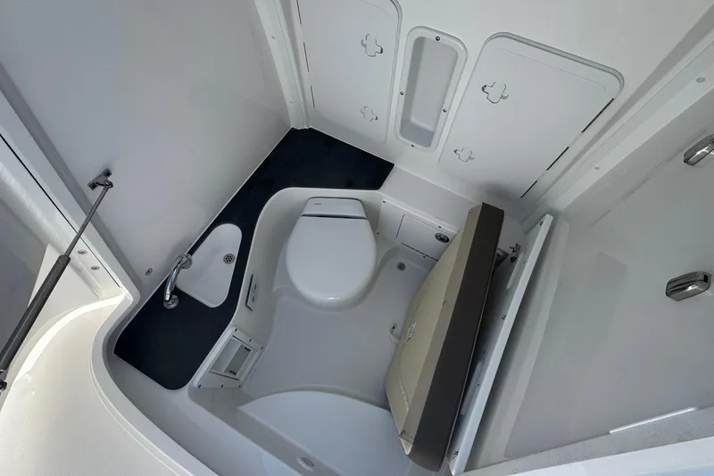 Slide: The Image of Interior of 2026 Edgewater 262CC boat bathroom with compact design and modern fixtures. - 51