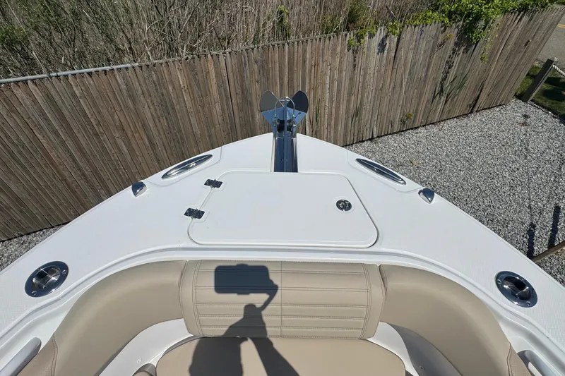 Slide: The Image of 2026 Edgewater 262CC boat bow with seating and anchor, viewed from above. - 55