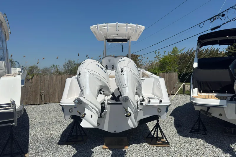 Slide: The Image of Edgewater 262CC 2026 with Yamaha engines on gravel lot. - 6