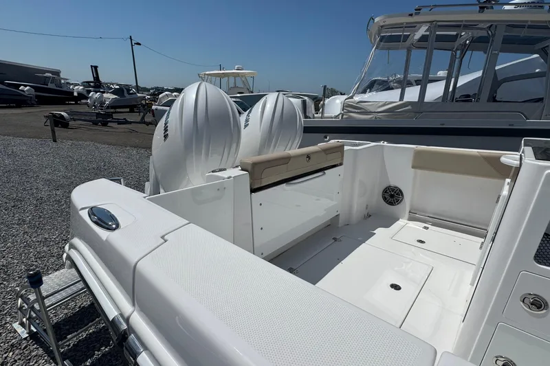 Slide: The Image of 2026 Edgewater 262CC boat with dual engines, spacious deck, and modern design. - 9