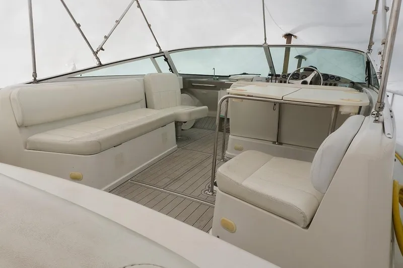 Slide: The Image of Interior of 2000 Carver 350 Mariner yacht with white seating and helm. - 13