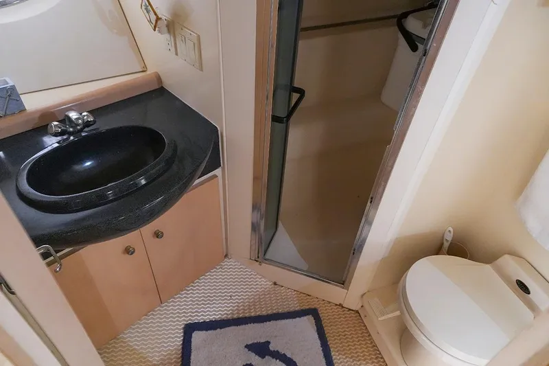 Slide: The Image of Bathroom interior of 2000 Carver 350 Mariner yacht with sink, shower, and toilet. - 25