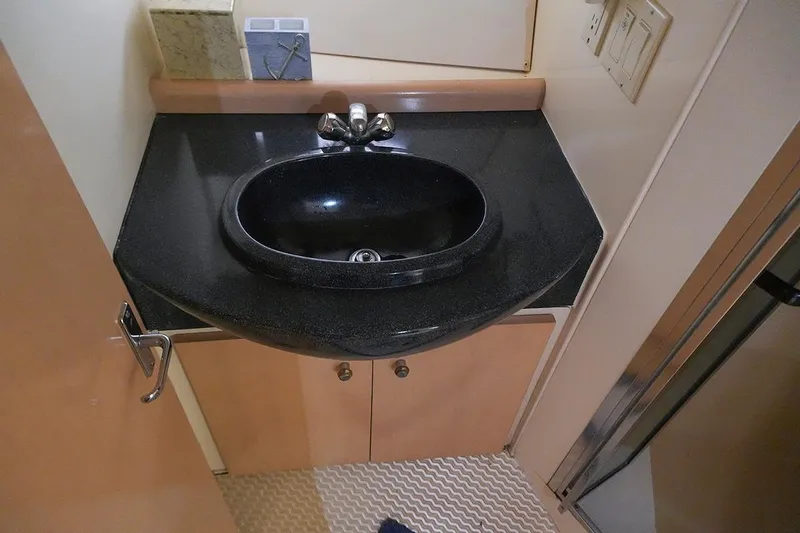 Slide: The Image of Black sink in 2000 Carver 350 Mariner bathroom with modern fixtures and cabinetry. - 26