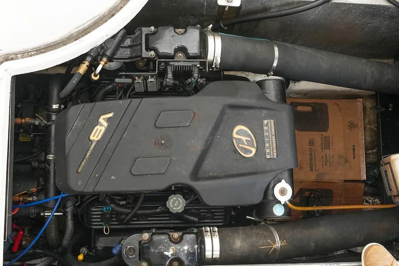 Slide: The Image of V8 engine of a 2000 Carver 350 Mariner boat, showcasing mechanical components. - 44