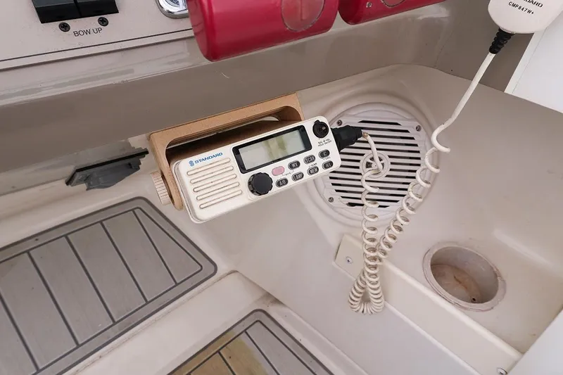 Slide: The Image of VHF radio and speaker on 2000 Carver 350 Mariner boat dashboard. - 7