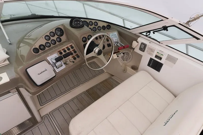 Slide: The Image of Cockpit of 2000 Carver 350 Mariner with Garmin navigation and classic steering wheel. - 9