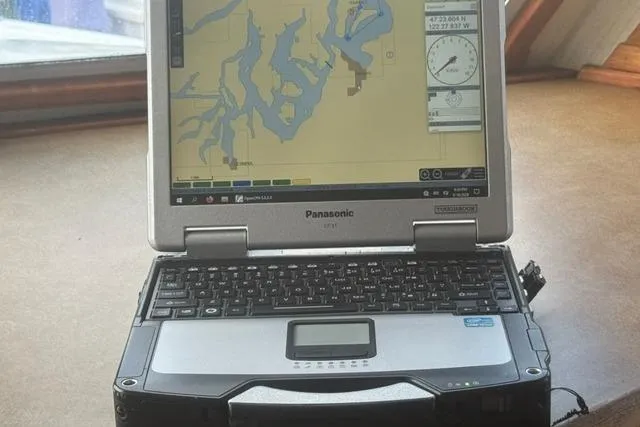 Slide: The Image of Panasonic Toughbook displaying nautical map inside 1984 Uniflite YACHTHOME. - 25
