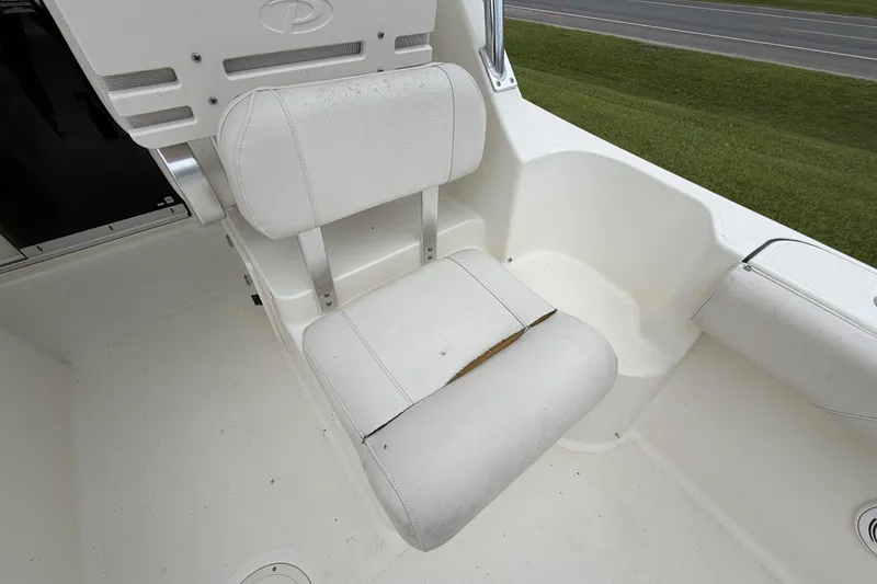 Slide: The Image of White seat on 2006 Pursuit 2570 Offshore boat, showing slight wear. - 24
