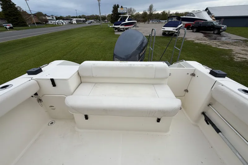 Slide: The Image of 2006 Pursuit 2570 Offshore boat interior with seating and Yamaha outboard motor. - 26